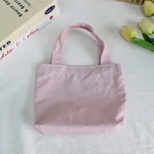 Pink nylon mini tote bag, lightweight waterproof handbag for daily use and cute lunch storage.