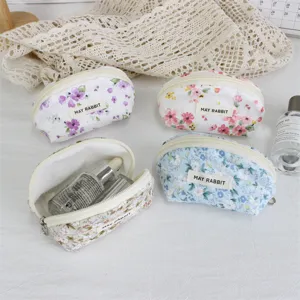 Cute floral half-round cosmetic pouch with zipper, portable makeup and coin storage bag.