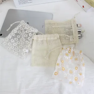 Little daisy embroidered drawstring mesh bags for jewelry, cosmetics, and small gift storage.