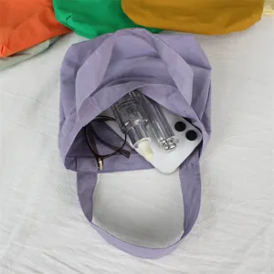 Detailed top view of lavender mini nylon tote bag, showing spacious interior and daily essentials.