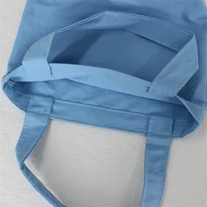 Close-up detail of the lightweight nylon mini tote bag, showing inner structure and sturdy stitching.