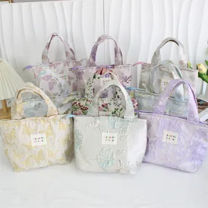 Vintage embossed jacquard bento bag detail shot showing multiple colors and patterns.