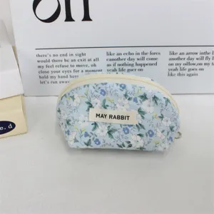 Cute floral shell cosmetic bag, portable zipper makeup pouch for daily use and travel storage.