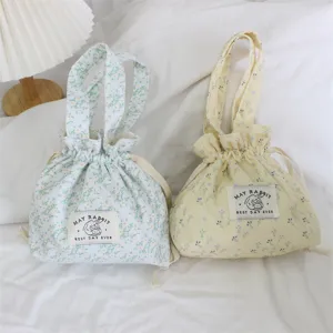 Cute floral corduroy drawstring tote bag, portable canvas bento bag for daily storage.