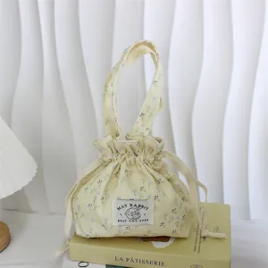 Corduroy floral drawstring handbag, cute small bento bag, portable daily storage bag.