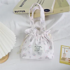 Floral corduroy drawstring handbag detail, cute portable daily storage pouch for women.