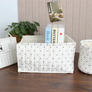 Quilted fabric storage basket desktop organizer with cute heart pattern for home decor.