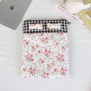 Detailed view of the cute bed-shaped quilted laptop sleeve, soft anti-shock pouch.