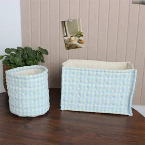Detail view of Korean ins-style quilted fabric storage basket in blue and white gingham.