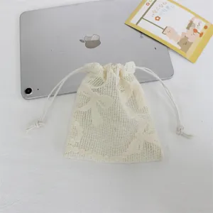 White mesh drawstring pouch for jewelry storage and cosmetic organization, elegant gift bag.