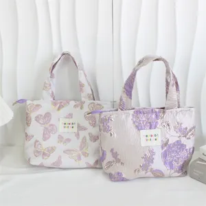 Vintage embossed jacquard bento bag with cute butterfly and floral patterns, large capacity.