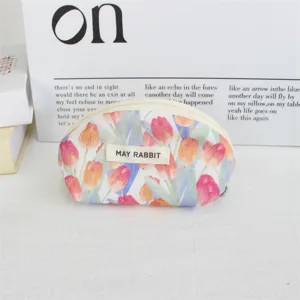 Close-up of the cute tulip print shell cosmetic bag, mini zipper coin purse detail view.