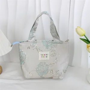 Vintage jacquard lunch bag with floral embossed pattern, spacious hand tote for daily use.