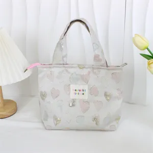 Detailed close-up view of the vintage jacquard lunch bag featuring cute glitter hearts pattern.