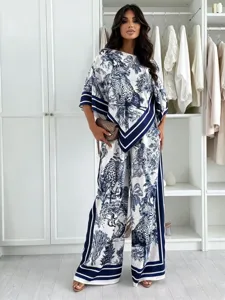 Detailed view of stylish women blue and white jungle print blouse and wide leg pants set.