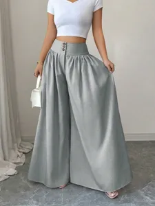 High-waisted wide-leg trousers with three-button closure, elegant drape, and loose fit for summer.