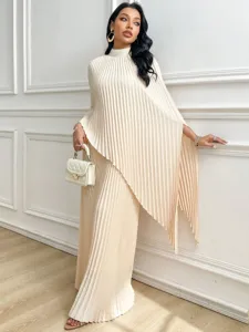Detail shot of the elegant pleated loose set with irregular cape top and wide pants.