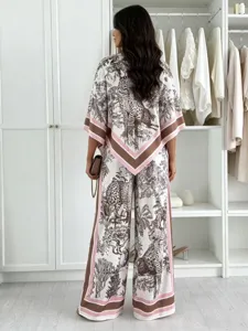Detailed view of the women's chic printed two-piece top and wide-leg pants outfit set.