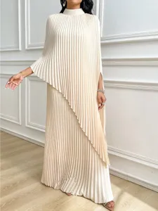 Detail shot of elegant pleated maxi dress featuring high collar and asymmetrical layered hem.