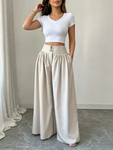 High waist wide leg trousers detail, elegant drape and three-button closure style.
