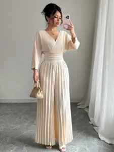 Elegant V-neck short sleeve pleated wide leg jumpsuit for women chic commute outfit style.