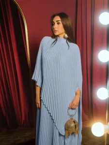 Detail view of the elegant light blue pleated long dress, showcasing the unique asymmetrical hem.