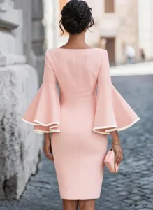 Detailed back view of a pink bodycon dress featuring dramatic white-trim bell sleeves.