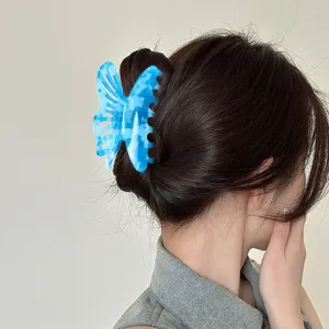 Pince a cheveux papillon creux en acetate bleue elegante pince requin pour les femmes