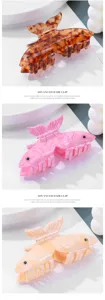 Details der Acetat Fisch Haarklammer mit exquisiter Fischform, bunten Farben und starkem Halt.