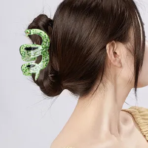 Stylish green snake acetate hair claw clip, trendy animal shark clip for women's elegant daily hairstyles.