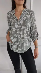 Details view of the casual long-sleeve floral print blouse featuring a chic sequin pocket.
