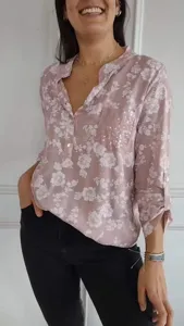 Close-up detail of casual long sleeve floral print shirt featuring a sparkling sequin pocket.