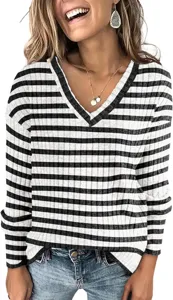 Close-up detail of the black and white striped V-neck long sleeve knit sweater texture.
