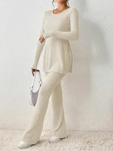 Beige ribbed knit two-piece lounge set featuring a slim long sleeve top and wide leg pants.