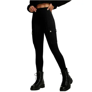 Close-up of black high-waist cargo leggings with utility pockets and stylish metallic button details.