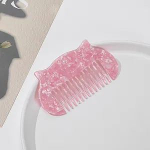 Cute pink cartoon cat hair comb for daily styling, portable acetate hair tool for women and girls.