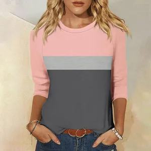 Close-up detail of color-block 3/4 sleeve top showing pink and grey stripes design texture.