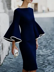 Elegant navy blue bodycon dress featuring dramatic white-trimmed bell sleeves detail view.