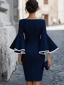 Back view detail of elegant navy blue bodycon dress featuring dramatic bell sleeves.