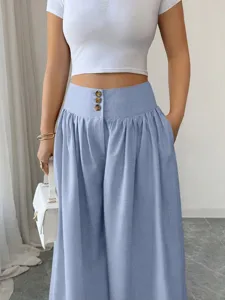 Detailed view of women high-waisted wide-leg casual pants with three-button closure and draped style.