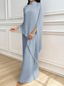Detail view of stylish light blue pleated maxi dress with elegant cape sleeves and high neck.