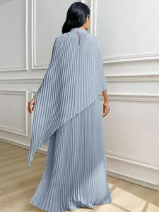 Detailed view of women elegant light blue pleated irregular two-piece dress back side.