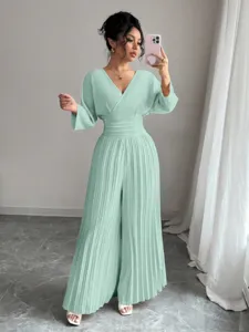 Elegant V-neck short sleeve pleated wide leg jumpsuit for women, chic commuter style.