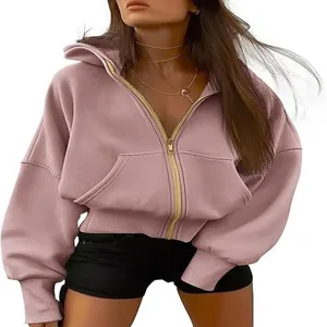 Detail view of women's pink zip-up hoodie featuring a front zipper and cozy hooded design.
