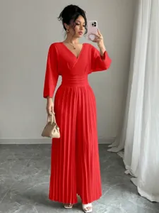 Elegant solid V-neck short sleeve pleated wide leg jumpsuit detail showcasing chic commuter style.