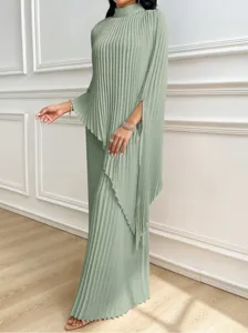 Elegant sage green pleated long sleeve dress detail showcasing exquisite texture and flow.