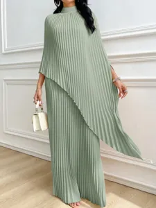 Elegant sage green pleated two-piece set featuring an asymmetrical design and mock neckline.