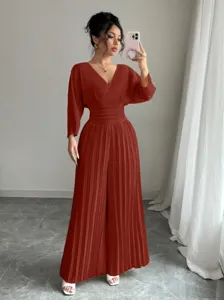 Elegant women's solid color V-neck short sleeve pleated wide leg jumpsuit for commuter fashion.