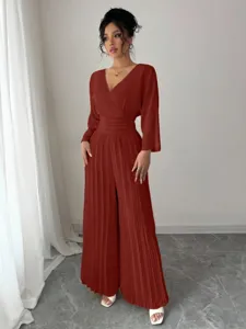 Elegant pleated jumpsuit for women, featuring a chic V-neck, long sleeves and high waist.