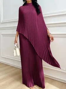Elegant wine red pleated long dress for women, stylish irregular hem design, chic autumn wear.